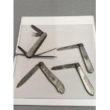 A Lot of 4 mother of pearl handled fruit knifes, 3 Of which are solid silver & the other is F.