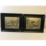 A Pair of WMF German silver plated relief plaques featuring fighting stags by Fitz Diller (1875-