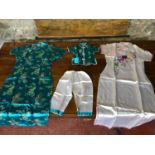 A lot of Chinese silk embroidered garments, to include a child's sized outfit