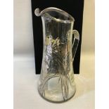 Sterling silver overlay water jug depicting floral design. Stands 28cm in height.