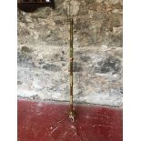 Onyx & brass standard lamp on tri-leg supports