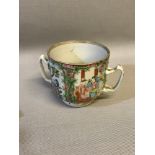 Chinese Canton Famille rose, two handle cup. Measures 10cm in height.