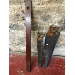 2 Vintage saws, together with a brass & wood spirit level