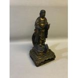 Large far eastern Buddha figure standing upon a turtle, possibly a shrine, Made from wood, Stands