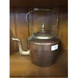 A vintage copper & brass kettle