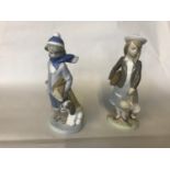 2 Lladro figurines, boy with a dog & a girl with her dolly.