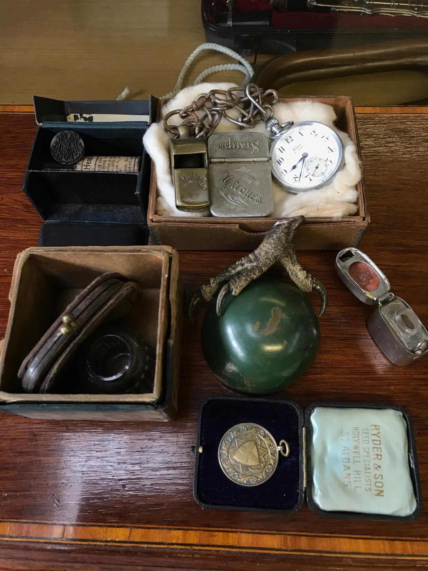 A Lot of mixed collectables which includes Thunder whistle, Silver fob medal, Seal and blotter &