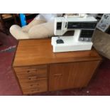 A Singer Symphone 300, together with a retro sewing cabinet, possible maker Nil Jonsson