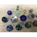 A Collection of 13 Caithness Scottish paperweights and Caithness perfume atomiser. Paperweights