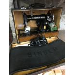 Vintage Electric singer sewing machine, comes with a fitted carry case.