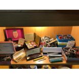 A Shelf full of costume jewellery, brooches, Vintage and modern pens which includes Sheaffer ,