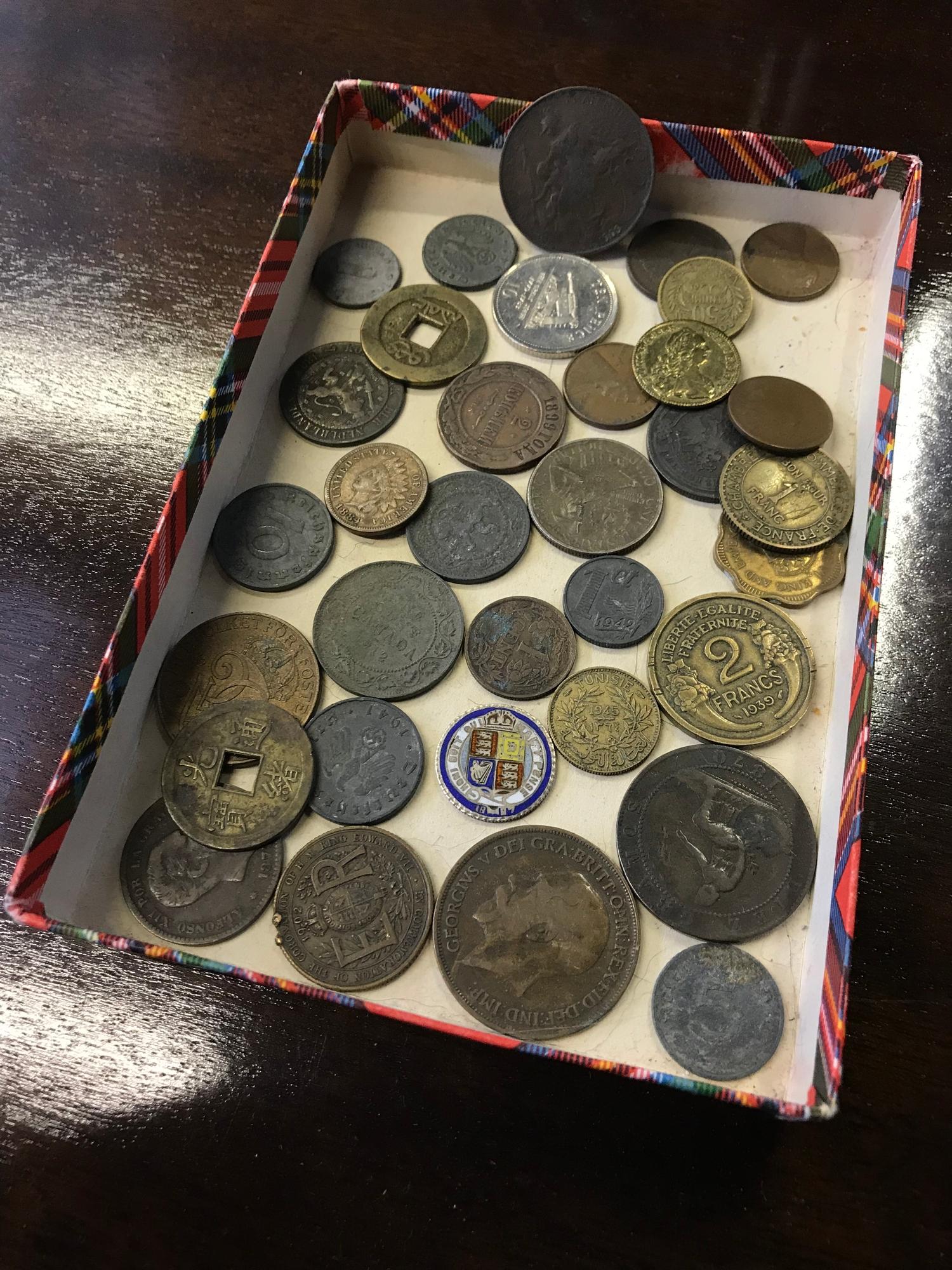 A Lot of mixed world coins which includes 1887 silver and enamel coin, 1865 & 1884 Indian head one