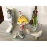 A mixed lot of porcelain figurines to include names; 'Royal Doulton' and 'Nao'