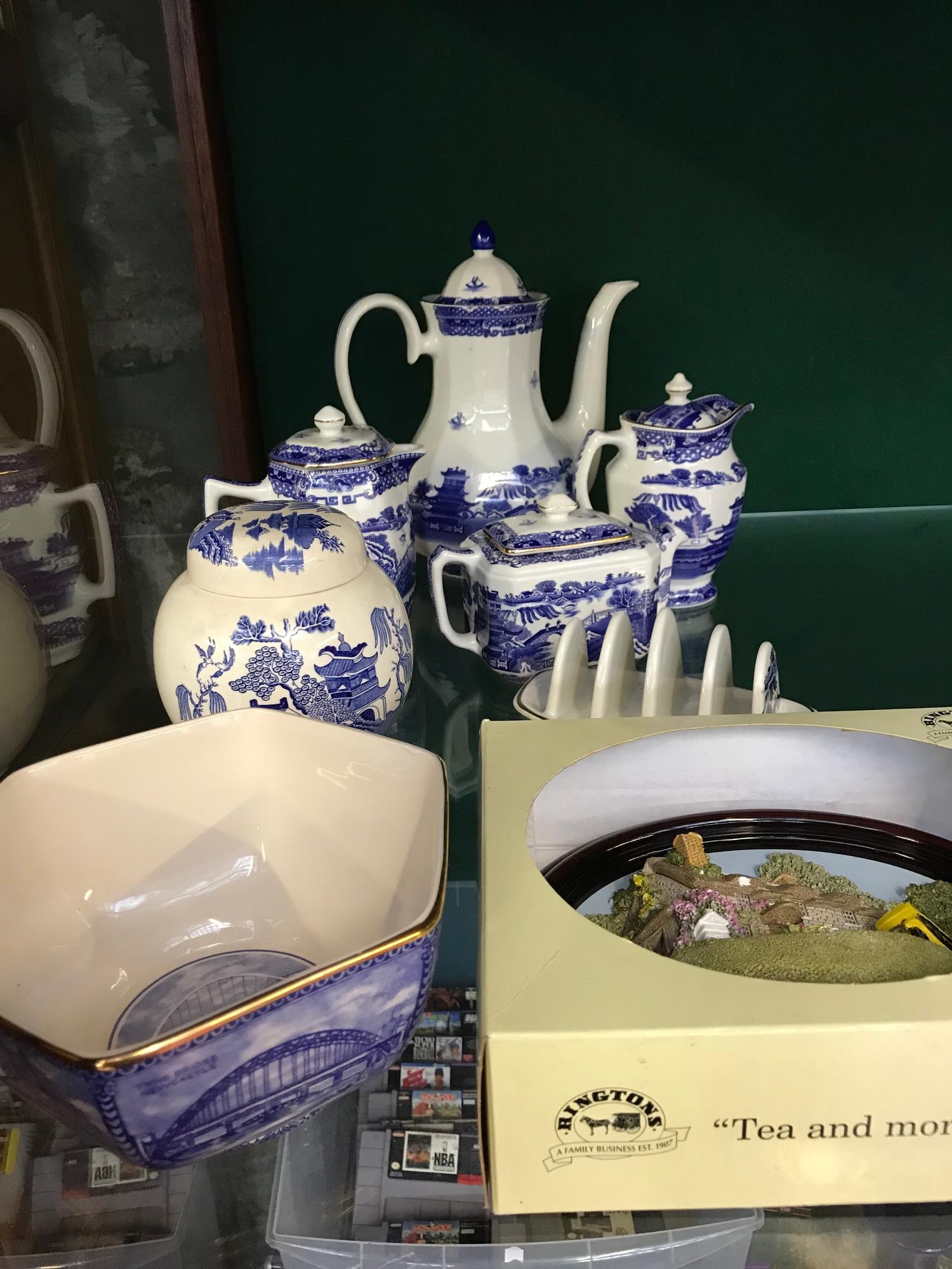 A Lot of blue and white Ringtons tea pots, bowls & toast rack etc