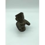 Solid bronze tribal figure. Stands 10.5cm in height.