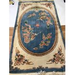 Large heavy wool oriental dragon design rug.