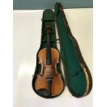 An antique violin with fitted case