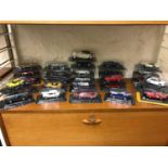A Shelf full of boxed car models