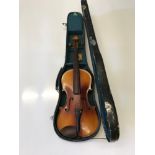 An antique violin with fitted case