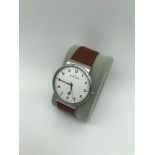 Gents Skagen slim case, brown leather strap, white dial watch.