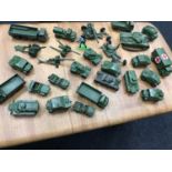 A Lot of Vintage Dinky armoured tanks and car models.
