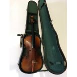 An antique violin with fitted case