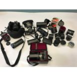 A Collection of Vintage cameras and lenses. Includes Tamron SP 1:8 500MM lens with carry case, Canon