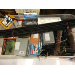 Box full of 00 Gauge track and accessories, Together with various hobby craft tools and controllers.