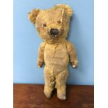 Early 1900s straw filled teddy bear.