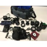 Canon EOS 1000 Camera with various lenses and accessories. Comes with Jessop carry bag.