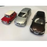 Three Kyosho 1/18 scale models