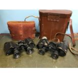 2 Pairs of old binoculars with cases, names such as Huet Paris and Busch solux