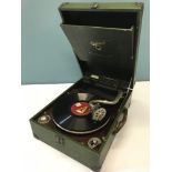 A 1920s Orchorsol portable gramophone, Styled in a green leather cloth covered case. Running order.
