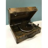 The Decca Rally vintage portable gramophone. Fitted within a snake skin style casing.