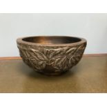 An Arts and crafts bowl styled with pewter berry overlay