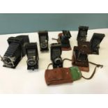 A collection of various bellow cameras to include Ensign, Voigtlander Bessa & Kodak etc