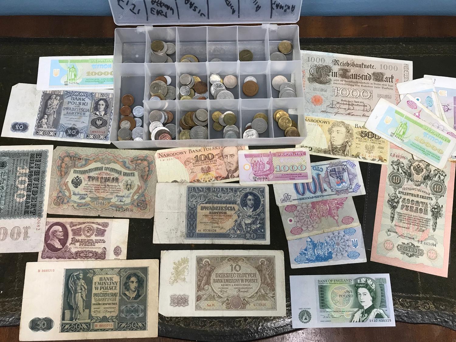 A Collection of mixed world bank notes and coins.