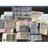 A Collection of mixed world bank notes and coins.