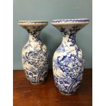 A pair of 1800s blue and white Chinese vases, Both stand 38cm in height.