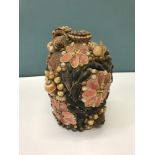 Antique Victorian flagon covered completely with various sized shells which depicts floral design.