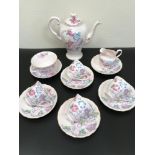 A thirteen piece Tuscan China tea set in a pastel pink and floral design