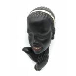 An Art Deco Austrian wall mask. By GK Fink. Measures 26cm in height.