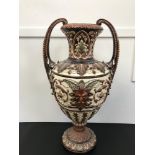 A Large Victorian twin handle Majolica Garniture vase. Designed with a face, Dionysus the god of