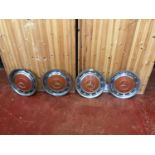 Four vintage Mercedes wheel hub caps