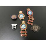 A small collection of motoring badges, to include Regarde St Christophe car dashboard badge
