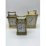 Antique French brass carriage clock together with two brass carriage clocks (Battery operated)