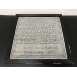A Victorian sampler, made by Mary Jane Bouse, dated 1849, 34x34cm (inc frame)
