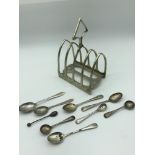 A Lot of silver hall marked condiment spoons & EP Toast rack