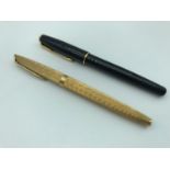 A Waterman C/F gold plated fountain pen with an 18ct gold nib, together with a Parker Sonnet