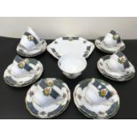 A 20 Piece Royal Standard Bonnie Scotland tea set. Design shows The Clan Macdonald crest.